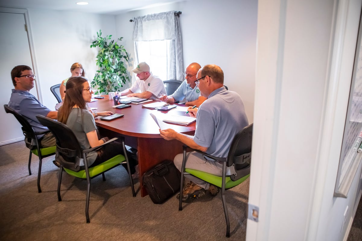 team meets at conference room table