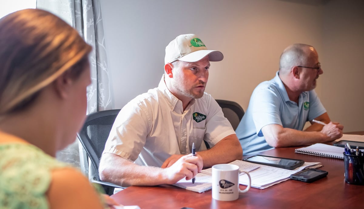 joshua tree team meets in conference room